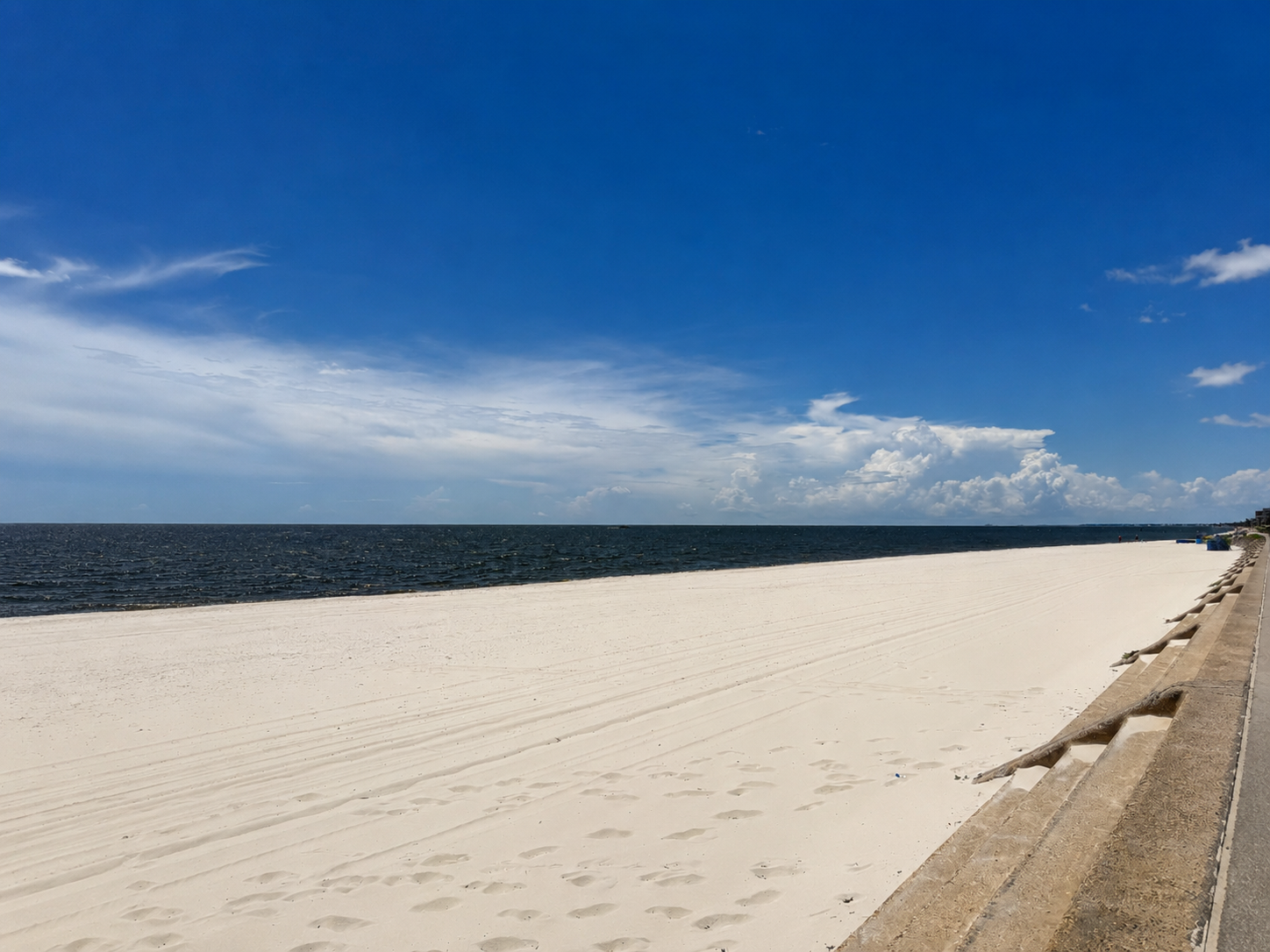 White sand and open Gulf water along Pass Christian Beach
